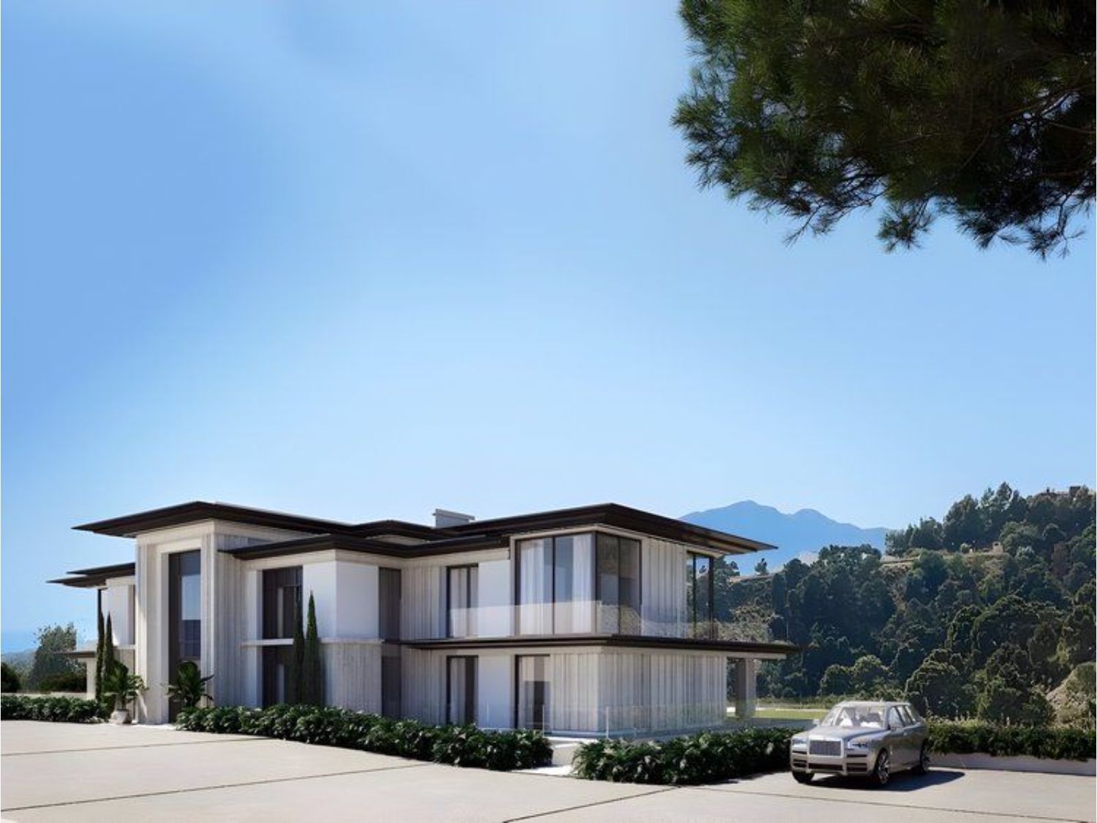 Modern two-story house with large windows, mountain view, and driveway.
